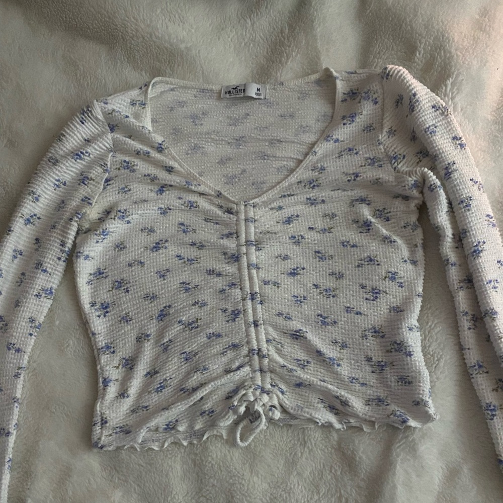 Long sleeve blue and white floral shirt. Size Medium.